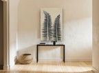 Twin Fern Fronds floral canvas print on the wall of a hallway