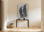 Twin Fern Silhouettes floral canvas print on the wall of a hallway