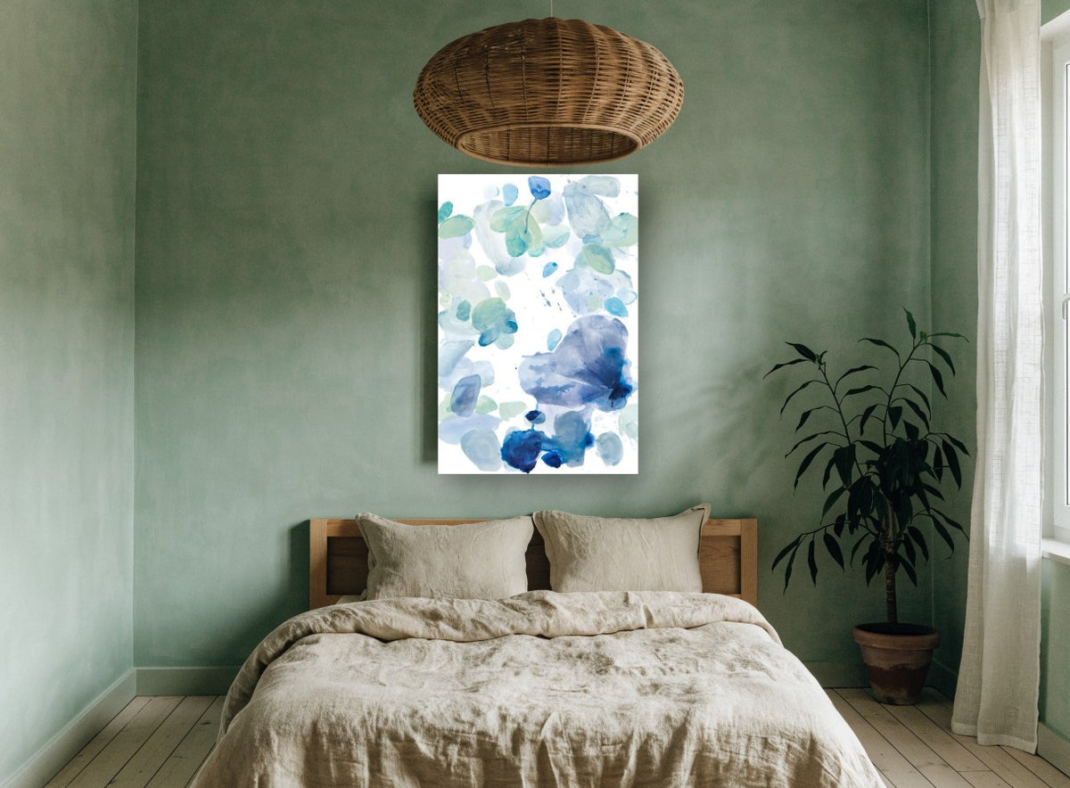 Blue Petal Drift floral canvas print on the wall of a bedroom