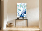 Blue Petal Drift floral canvas print on the wall of a hallway