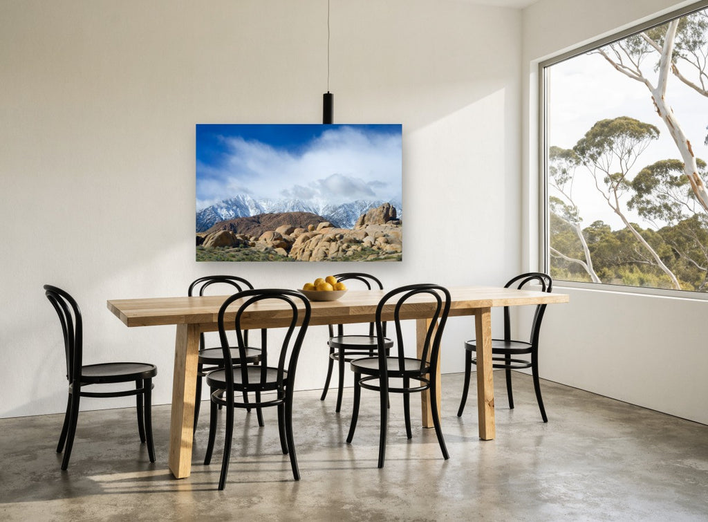 Boulders Beneath Snow Peaks landscape canvas print on the wall of a dining room