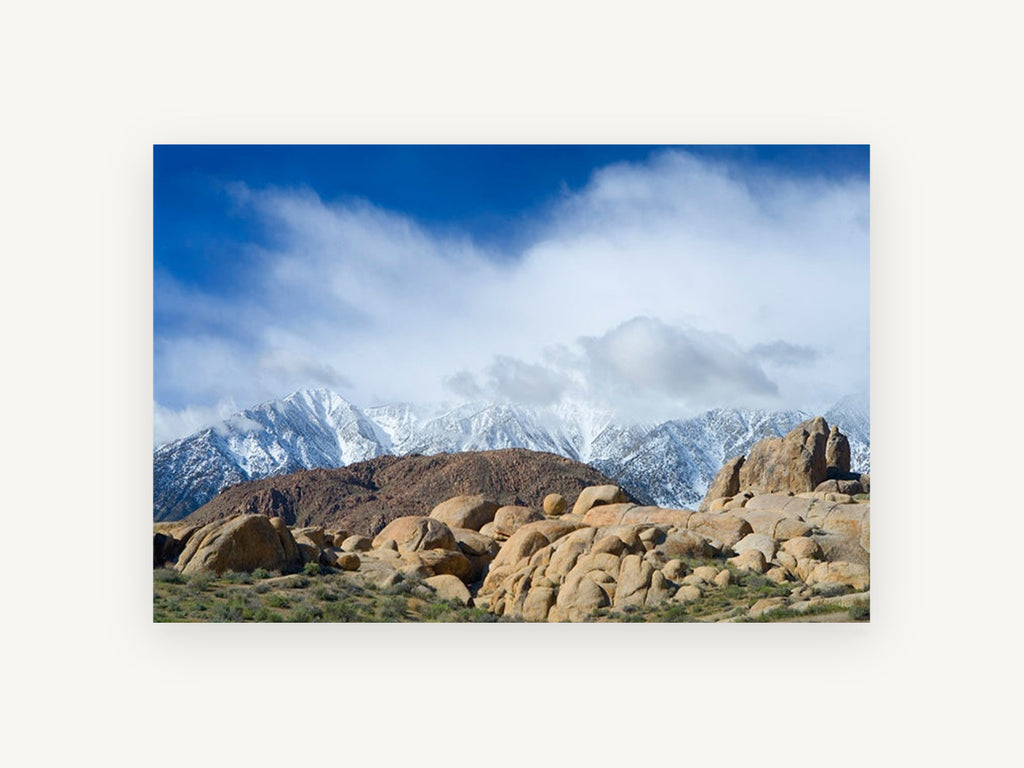 Boulders Beneath Snow Peaks, snowy mountains rocky boulders photograph, landscape canvas wall art print, front view