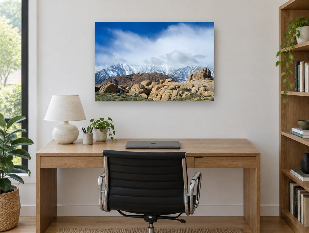 Boulders Beneath Snow Peaks landscape canvas print on the wall of a study