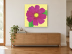 Magenta Cosmos Bloom floral canvas print on the wall of a living room above a sideboard