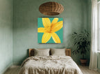 Golden Lily on Teal floral canvas print on the wall of a bedroom