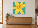 Golden Lily on Teal floral canvas print on the wall of a living room above a sideboard