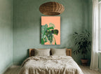 Monstera Collage on Peach floral canvas print on the wall of a bedroom
