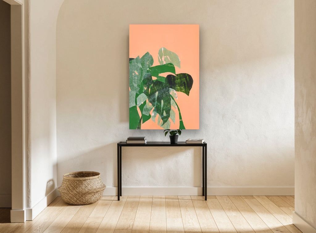 Monstera Collage on Peach floral canvas print on the wall of a hallway