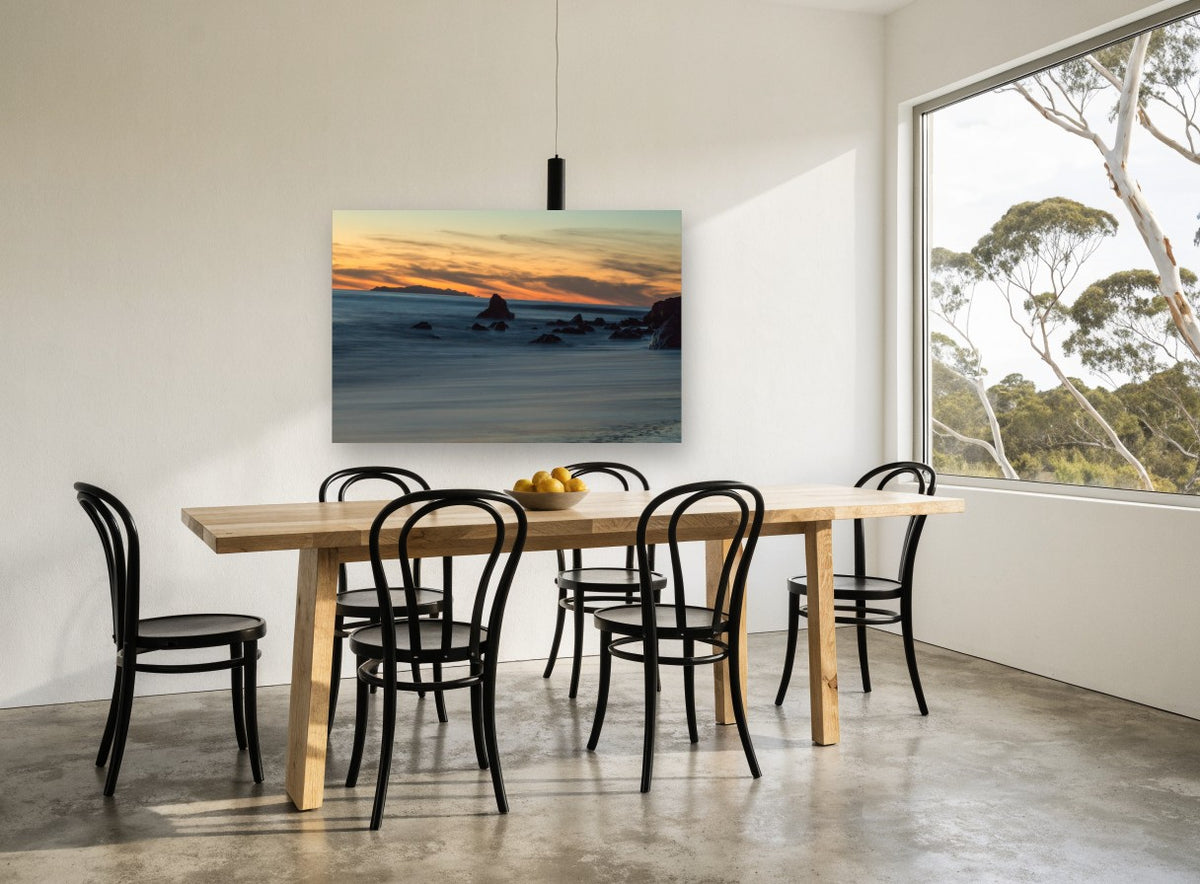 Dusk Rocks Silk Tide coastal canvas print on the wall of a dining room