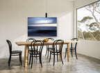 Dusk Blur Horizon coastal canvas print on the wall of a dining room