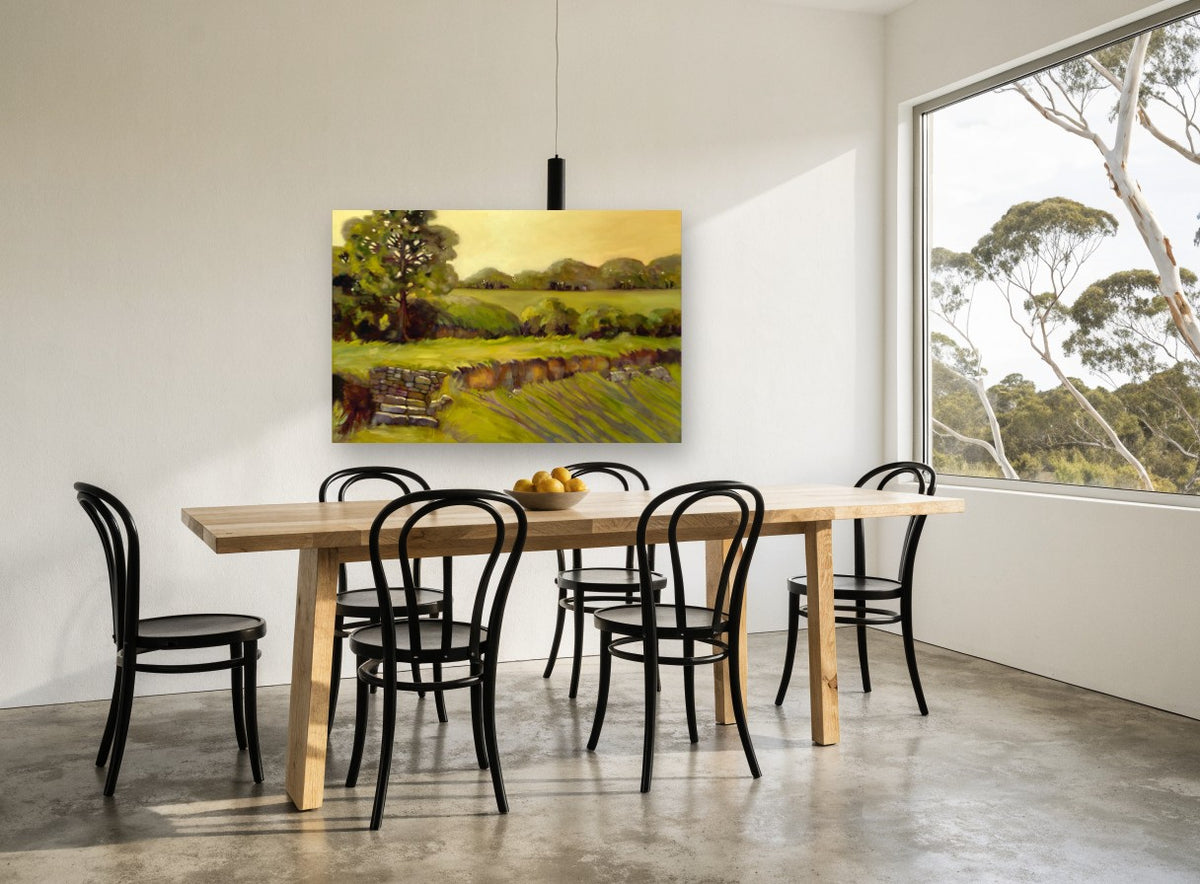Golden Stone Wall Pasture landscape canvas print on the wall of a dining room