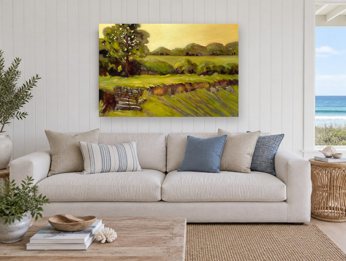 Golden Stone Wall Pasture landscape canvas print on the wall of a beach house living room