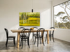 Birch Meadow Glow landscape canvas print on the wall of a dining room