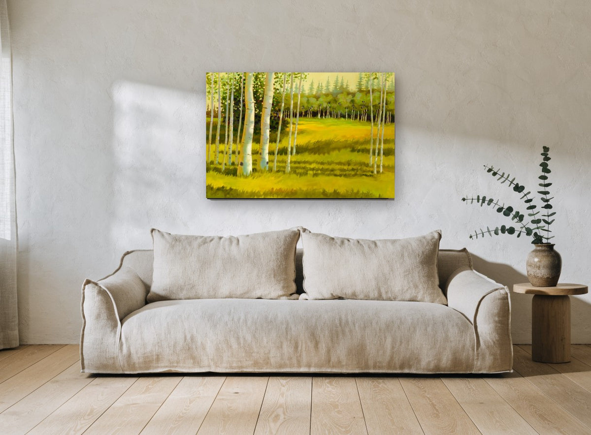 Birch Meadow Glow landscape canvas print on the wall of a living room