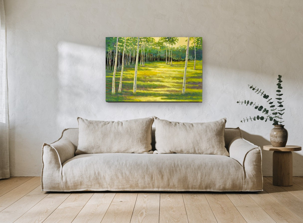 Birch Glade Light landscape canvas print on the wall of a living room