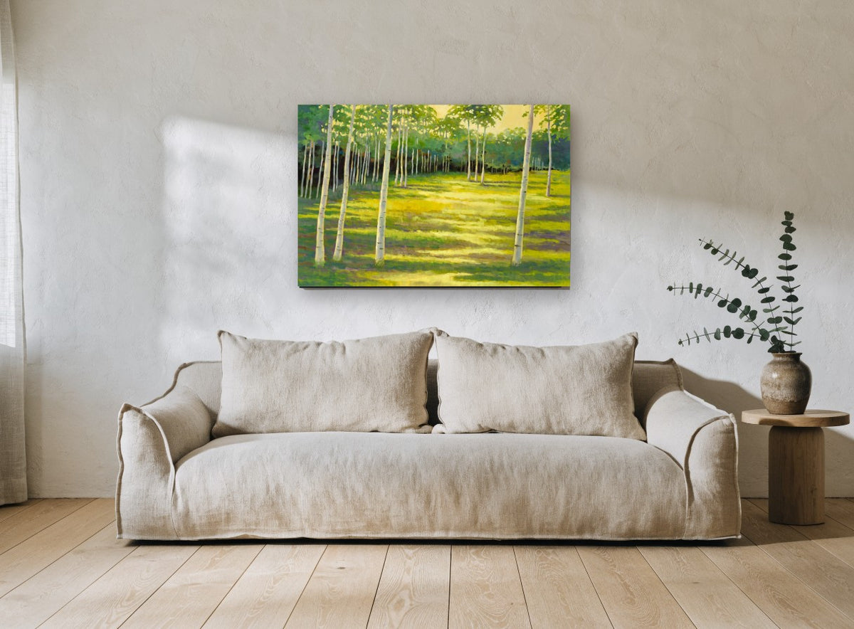 Birch Glade Light landscape canvas print on the wall of a living room