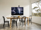Storm Over Treeline landscape canvas print on the wall of a dining room