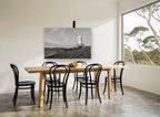 Lonely Shore Beacon coastal canvas print on the wall of a dining room