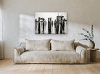 Barnacled Pier Posts coastal canvas print on the wall of a living room