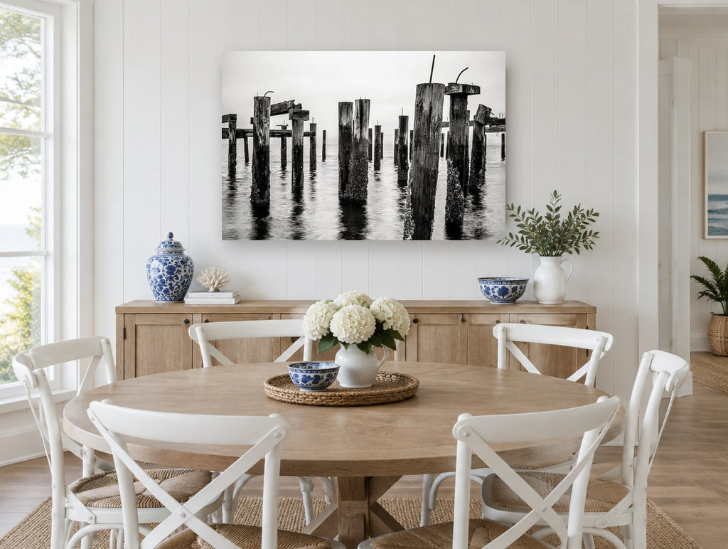 Barnacled Pier Posts coastal canvas print on the wall of a Hamptons dining room