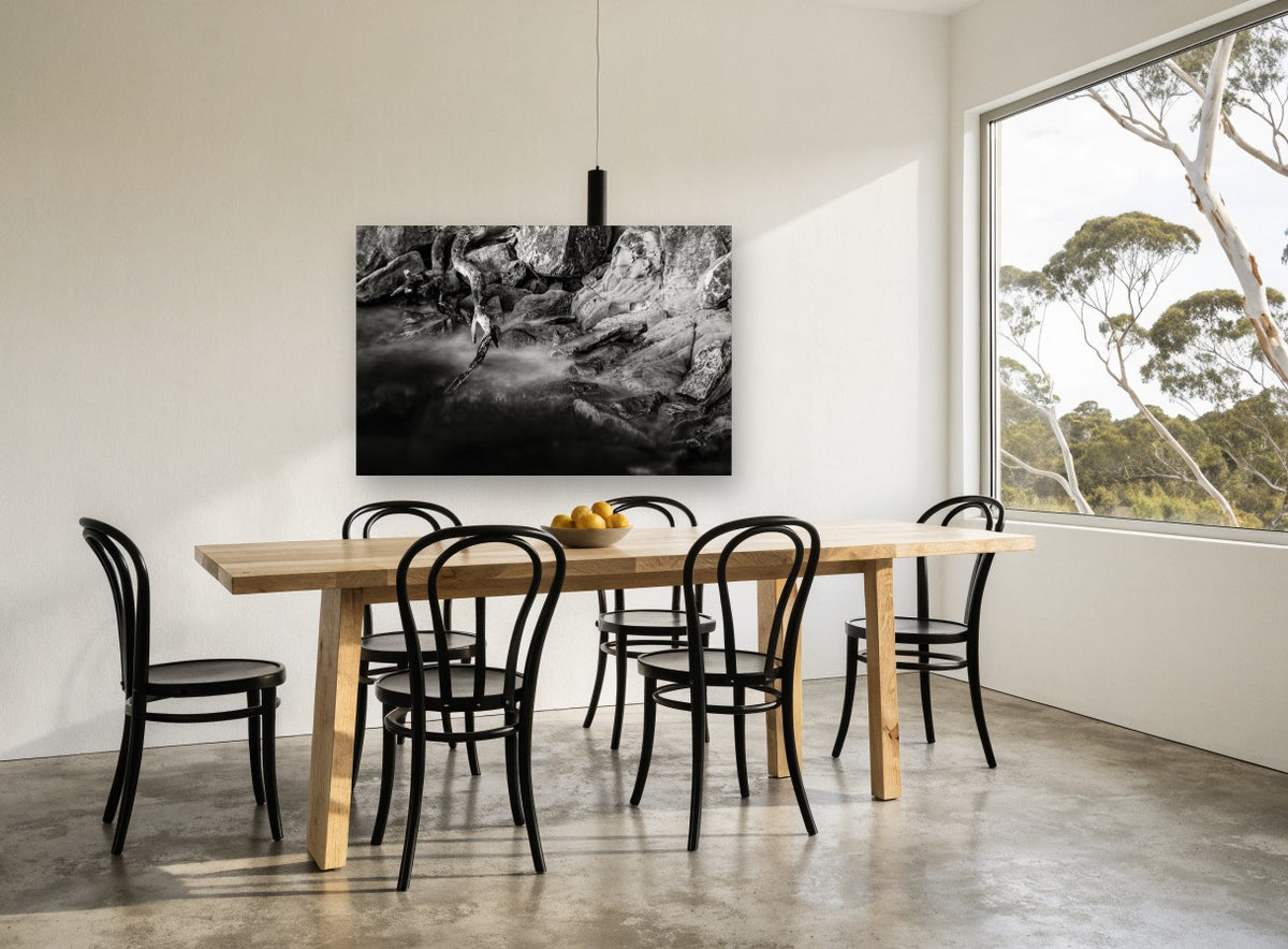 Driftwood and Still Water landscape canvas print on the wall of a dining room