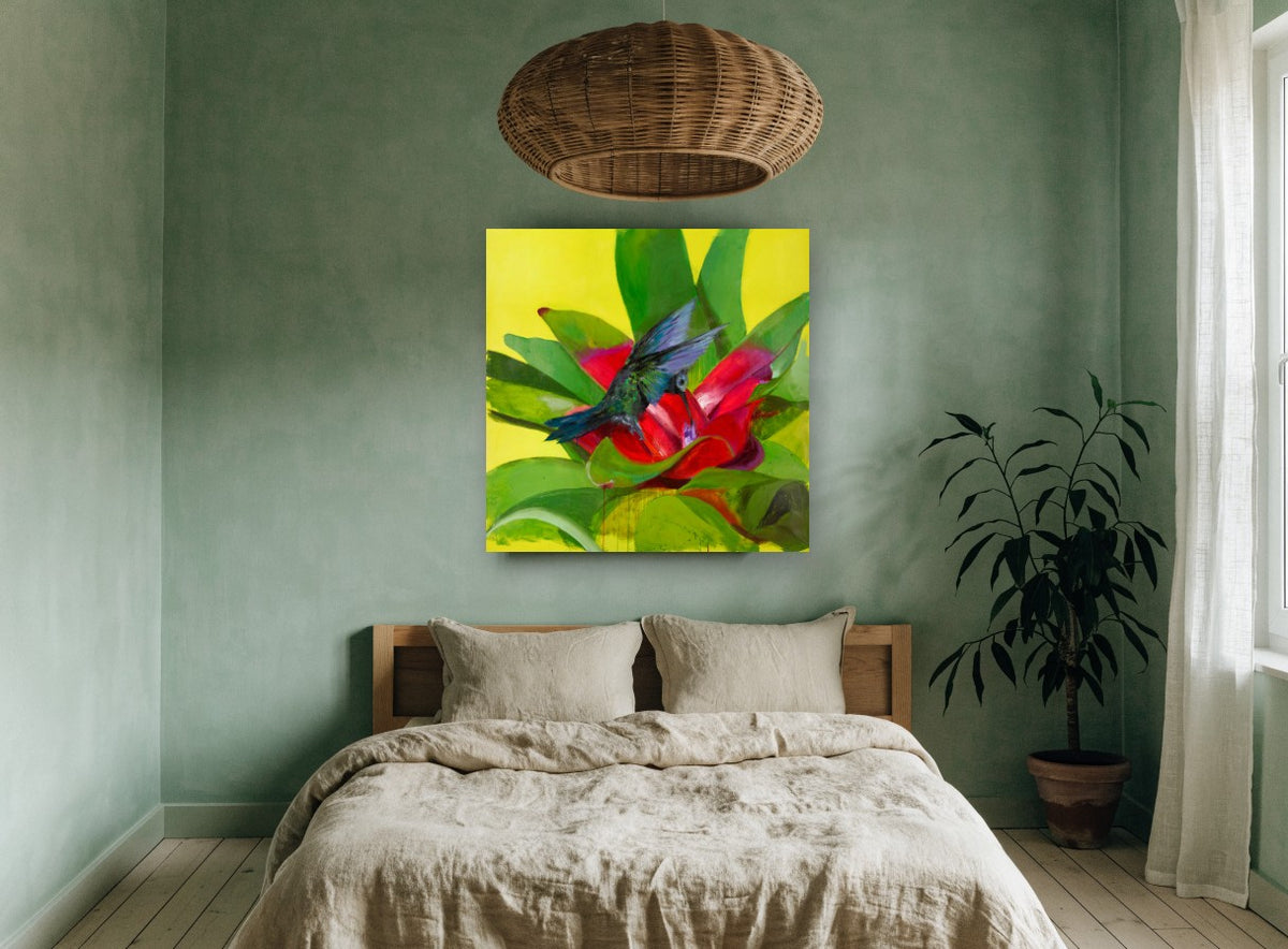 Hummingbird at Red Bromeliad floral canvas print on the wall of a bedroom