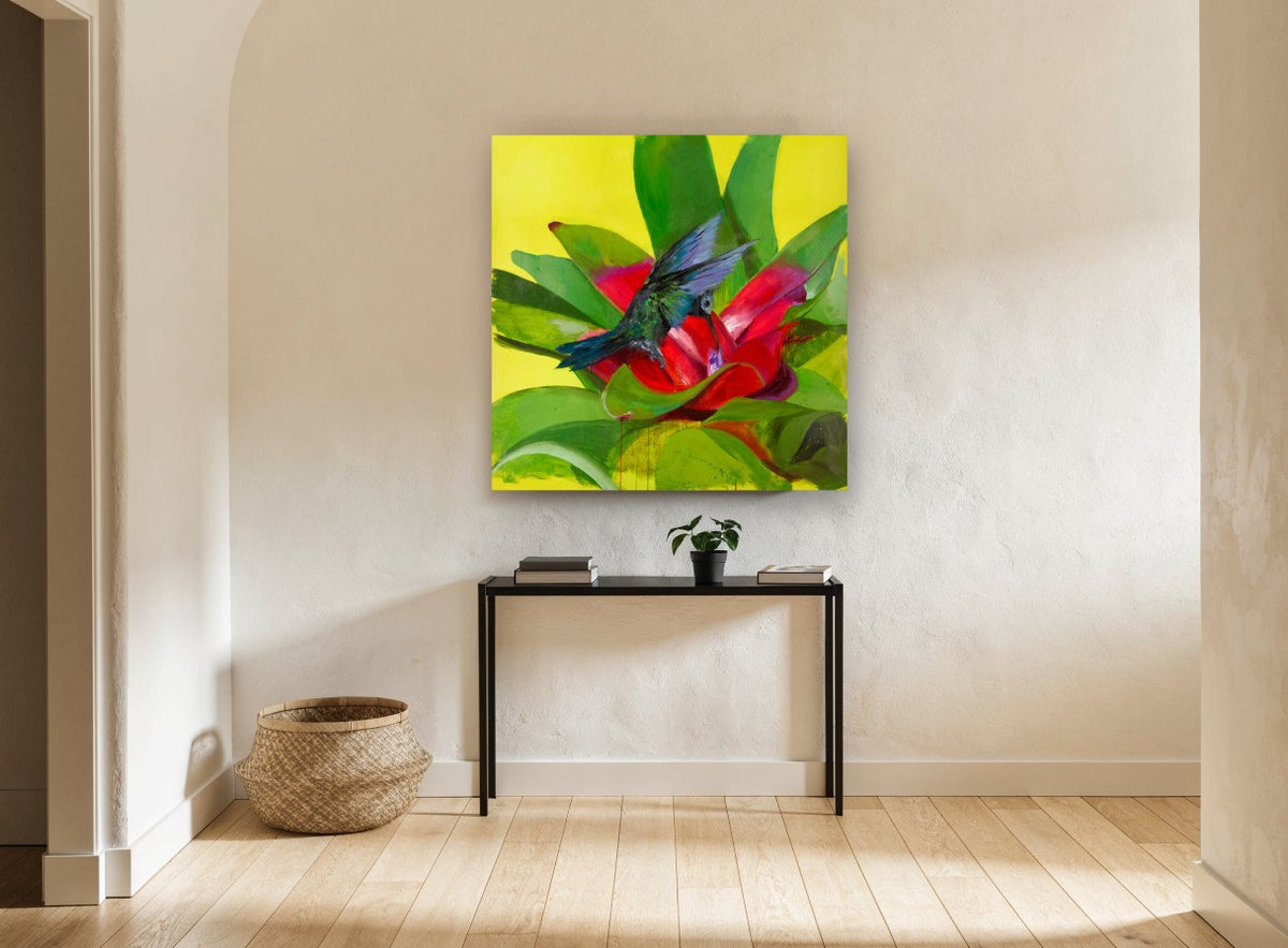 Hummingbird at Red Bromeliad floral canvas print on the wall of a hallway