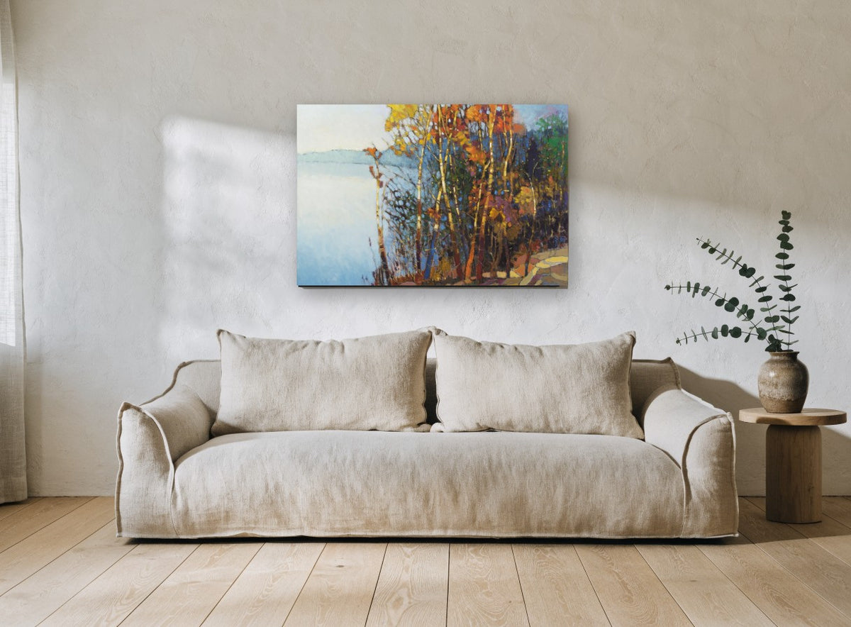 Autumn Birches by the Lake landscape canvas print on the wall of a living room
