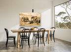 Elephant Family Crossing animal canvas print on the wall of a dining room