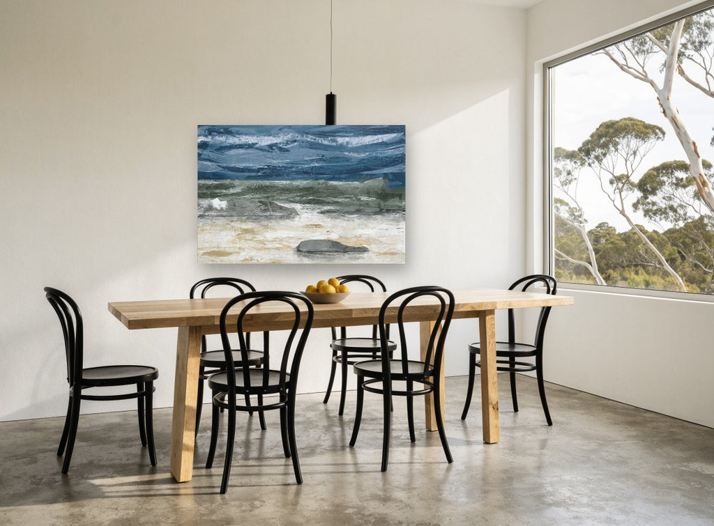 Grey Stones Storm Shore coastal canvas print on the wall of a dining room