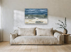 Grey Stones Storm Shore coastal canvas print on the wall of a living room