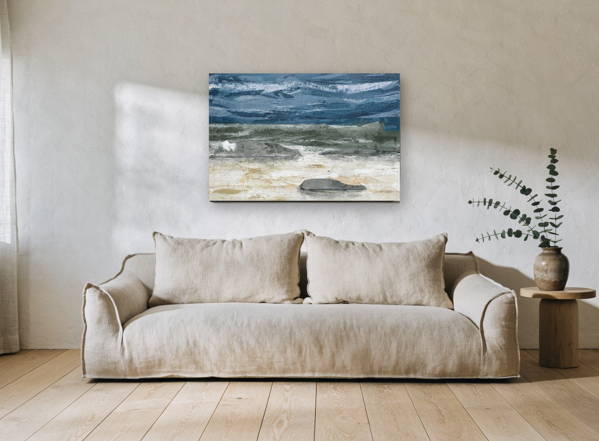 Grey Stones Storm Shore coastal canvas print on the wall of a living room