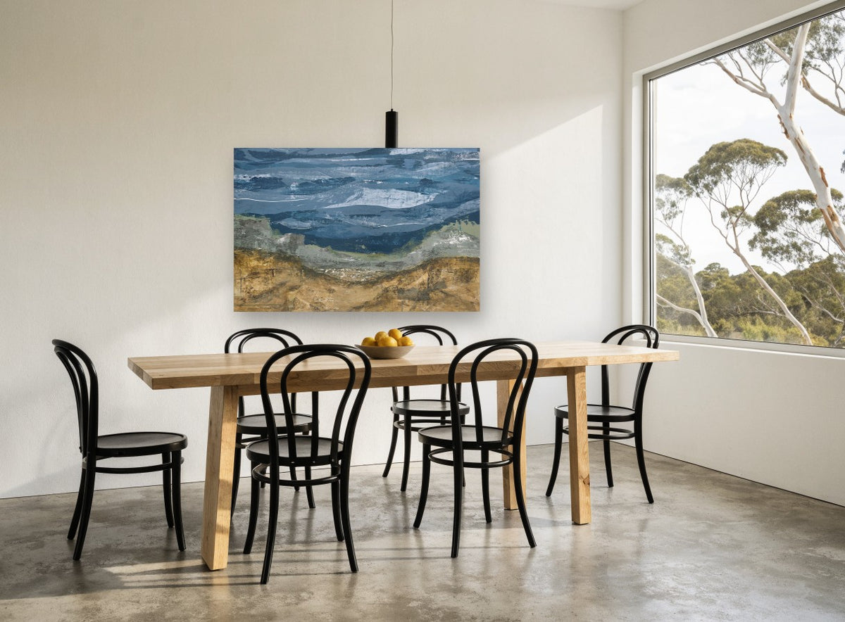 Ochre Hills Over Slate Sea coastal canvas print on the wall of a dining room