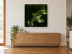 Green Wings in Flight animal canvas print on the wall of a living room above a sideboard