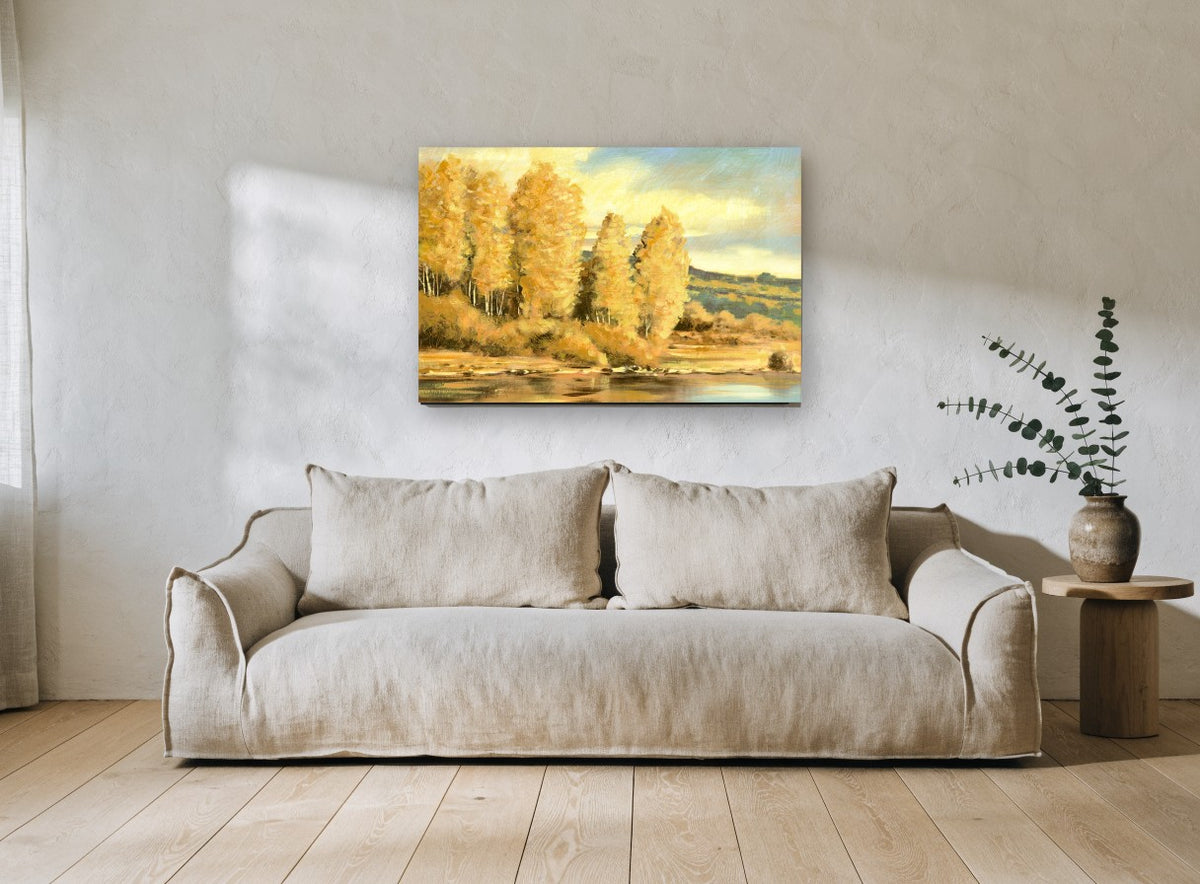 Golden Aspens by the River landscape canvas print on the wall of a living room