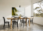 Misty Cliff Headlands coastal canvas print on the wall of a dining room