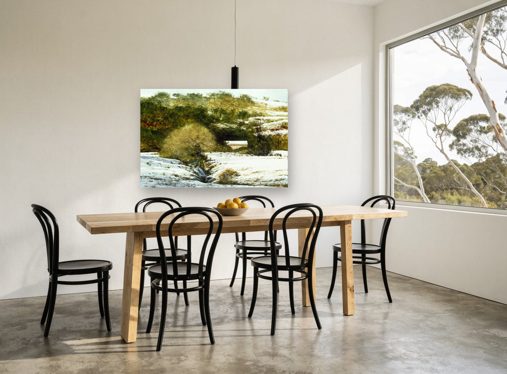 Snowy Hollow Barn landscape canvas print on the wall of a dining room