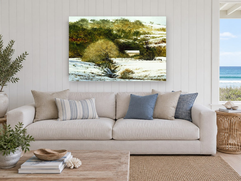 Snowy Hollow Barn landscape canvas print on the wall of a beach house living room