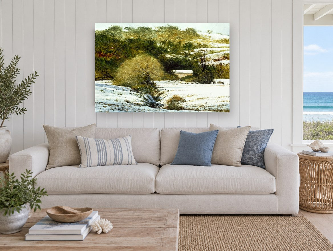Snowy Hollow Barn landscape canvas print on the wall of a beach house living room