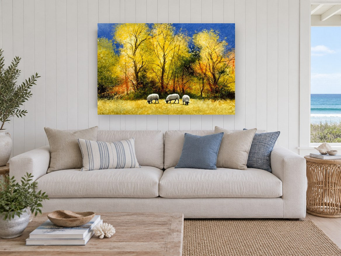 Sheep Under Golden Trees landscape canvas print on the wall of a beach house living room