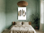 Six Owl Feathers animal canvas print on the wall of a bedroom