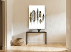 Six Owl Feathers animal canvas print on the wall of a hallway