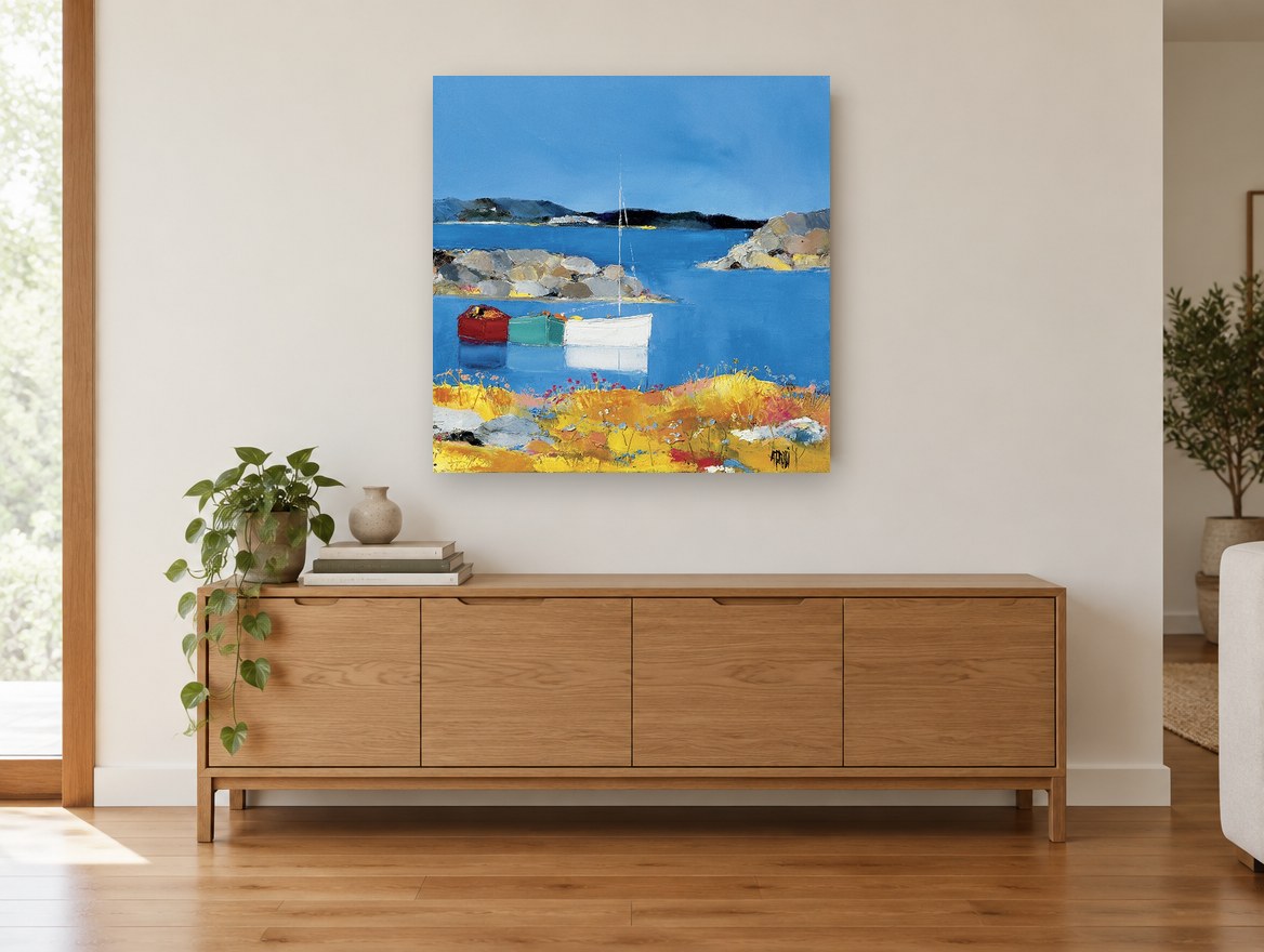 Three Boats Moored Cove coastal canvas print on the wall of a living room above a sideboard