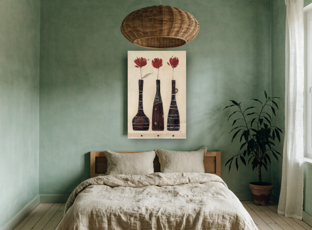 Three Red Blooms floral canvas print on the wall of a bedroom
