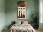 Three Red Blooms floral canvas print on the wall of a bedroom