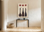 Three Red Blooms floral canvas print on the wall of a hallway