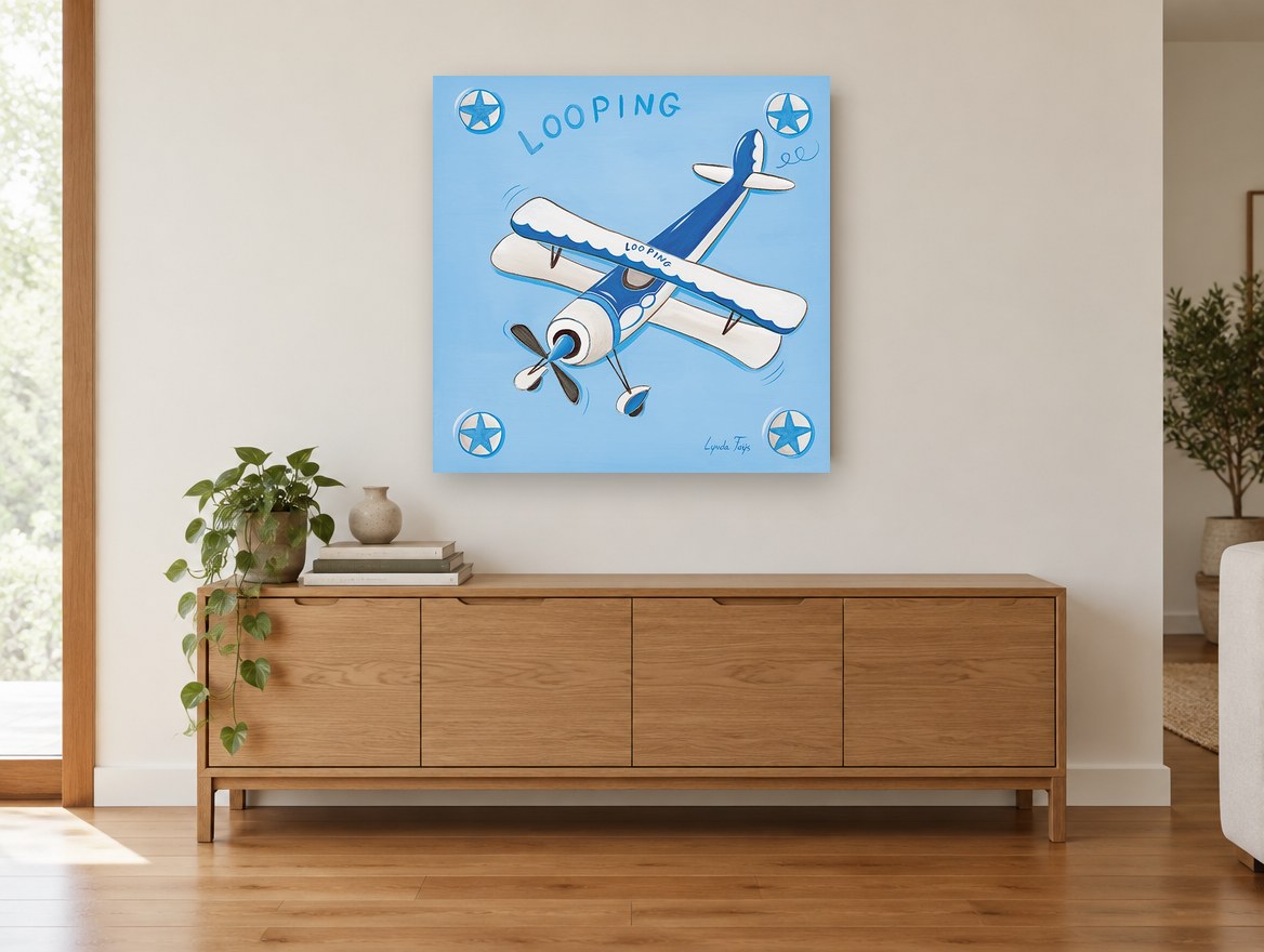 Blue Looping Biplane kids canvas print on the wall of a living room above a sideboard