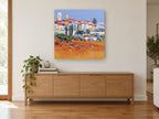 Terracotta Hill Village landscape canvas print on the wall of a living room above a sideboard