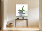 Stacked Stones Bamboo Calm floral canvas print on the wall of a hallway