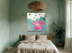 Pink Dogwood on Teal floral canvas print on the wall of a bedroom